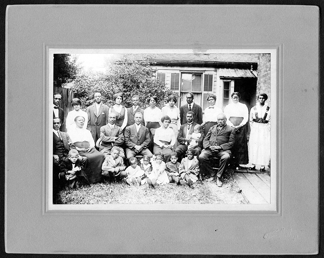 Old family photograph before and after AI restoration — Before